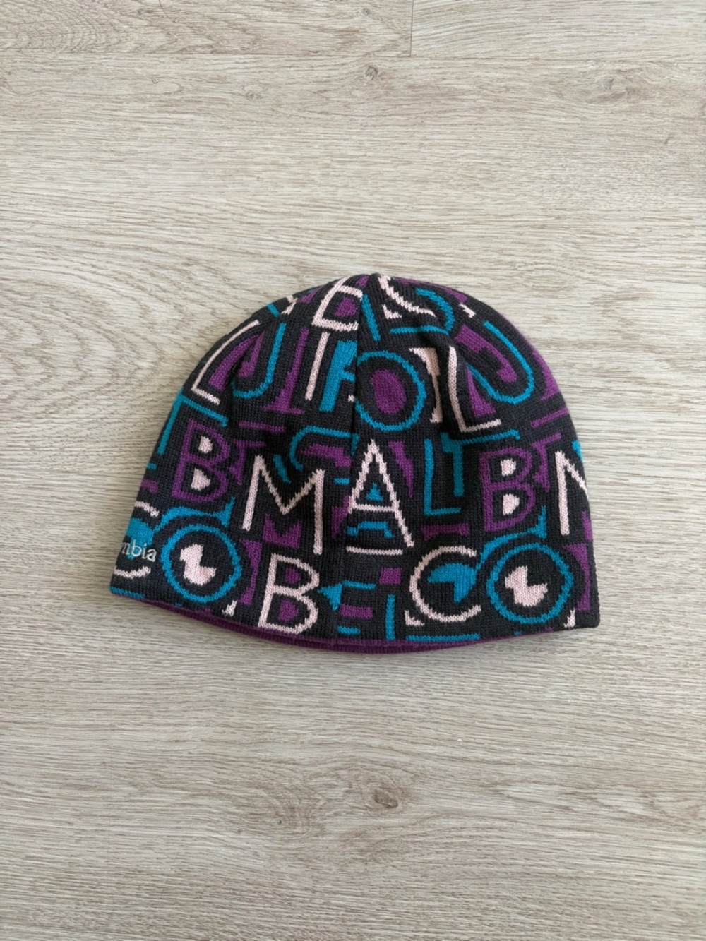 Reversible Columbia Black Beanie with Teal, Purple & Light Pink Lettering